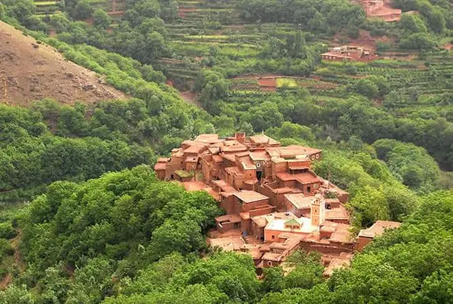 Azaden Valley with lush green terraces and Atlas Mountains